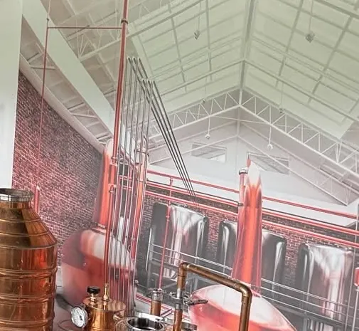 Copper pot stills and column in the Outlaw Hollow still house