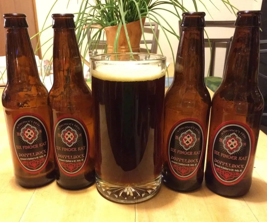 Bottles of Six Finger Kat Doppelbock with red and black medallion labels
